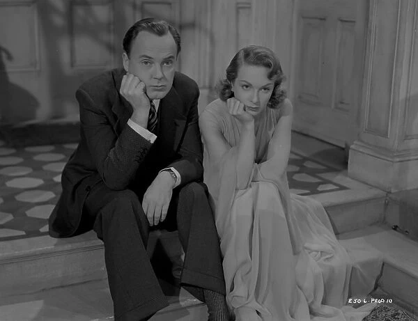 Thoughtful Derek Farr and Joan Greenwood in a scene from ...
