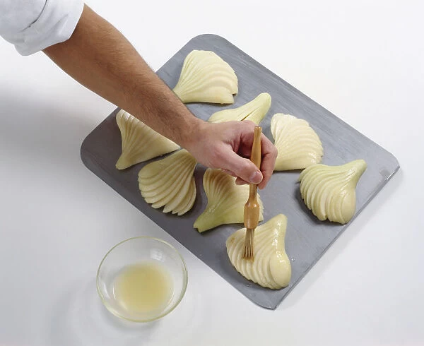 Brushing a pear fan with lemon juice