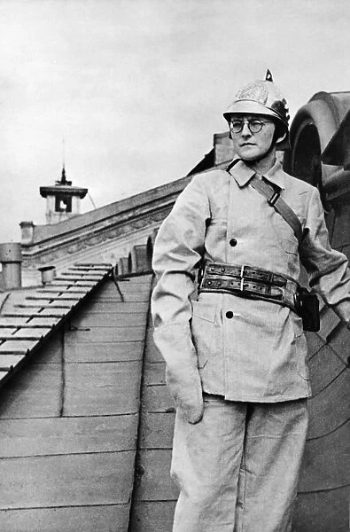 Composer dmitri shostakovich, member of the volunteer fire fighting squad of the leningrad conservatory, during a drill during world war ll