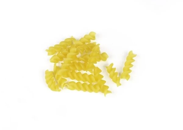 Corn fusilli pasta on white background