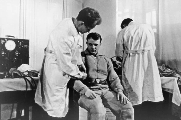 Cosmonaut yuri gagarin undergoing a medical exam prior to his space flight, 1961