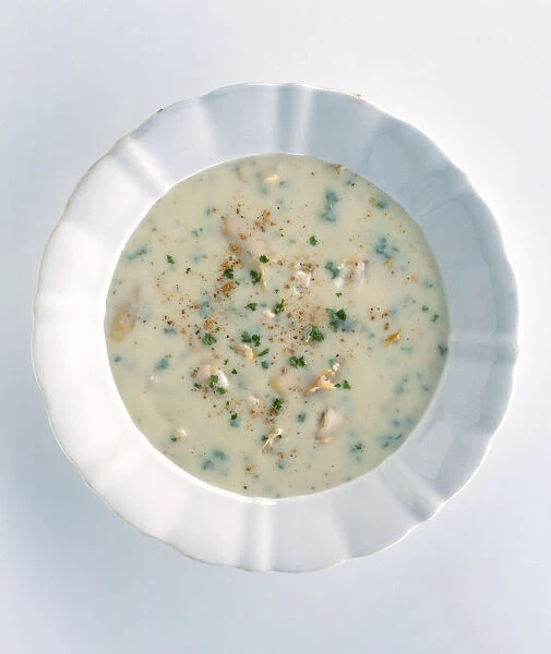 Cullen skink, bowl of traditional Scottish soup made from smoked haddock, milk and mashed potato, garnished with chopped parsley
