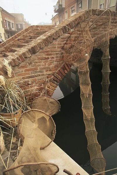 Italy, Emilia-Romagna Region, Comacchio (Ferrara Province), Po Delta Regional Park, Nets for eel fishing by bridge