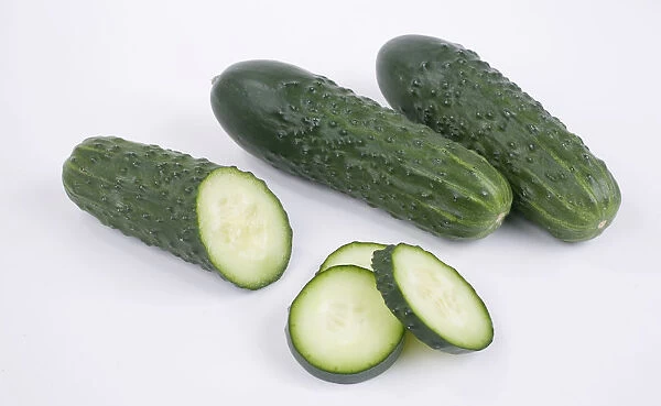 Kirby cucumber, a type of pickling cucumber, whole and sliced
