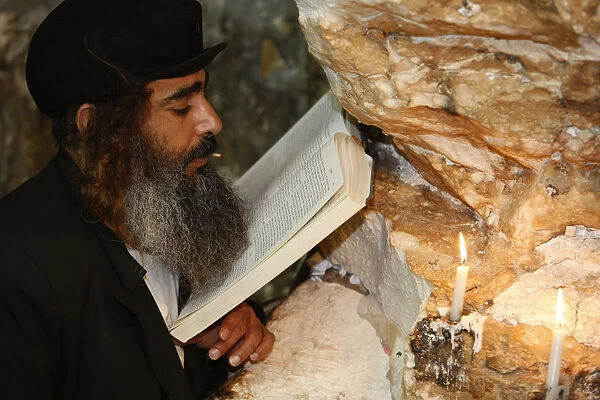 Man reading in Elijahs cave synagogue in Haifa