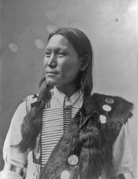 Native American man, half-length portrait by Heyn Photo, c1899