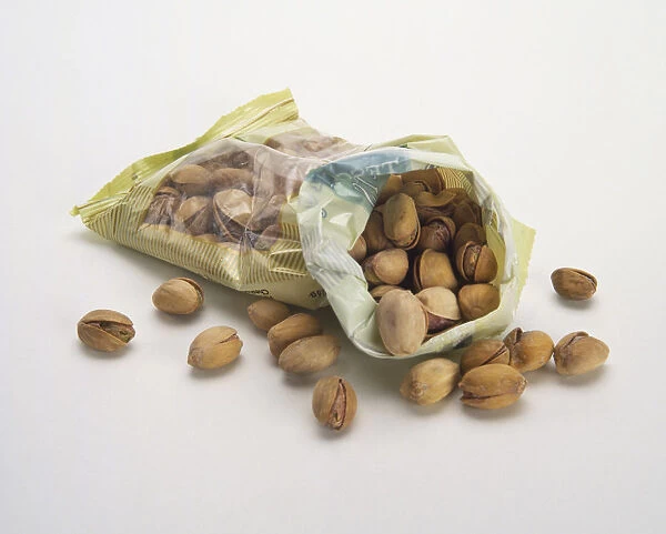 Pistachio nuts spilling from bag