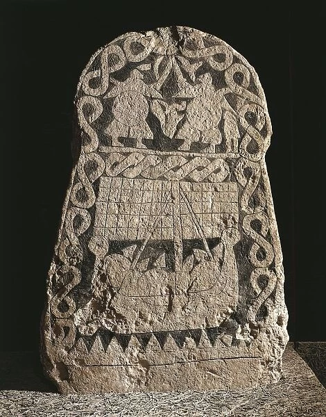 Sweden, Gotland, Runestone depicting two warriors fighting and the journey of the Vikings to the Valhalla