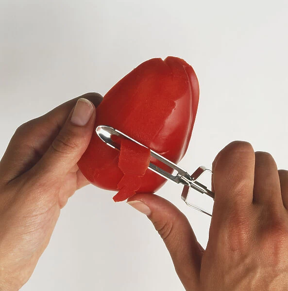 Using a vegetable peeler to remove the skin from a red