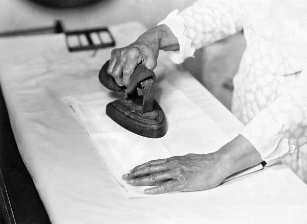 Woman Ironing With FLat Iron