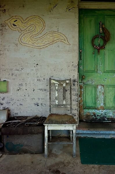 old chair and green door