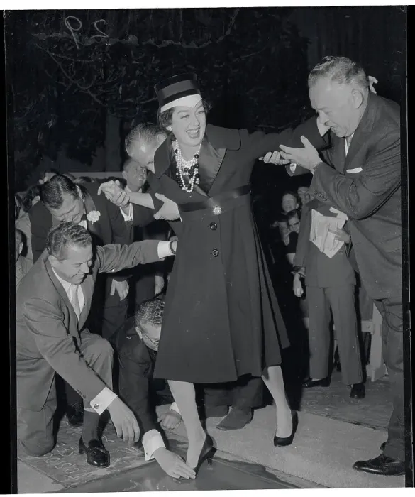 Framed Print : Rosalind Russell Makes Footprints at Grauman Chinese Theater Print