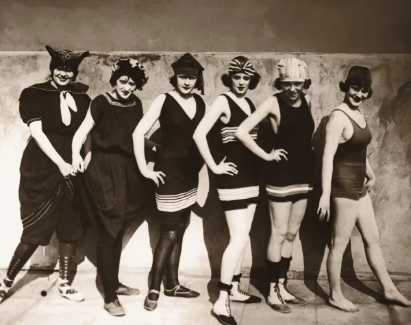 Group of young women wearing bathing suits, portrait (B&W sepia)