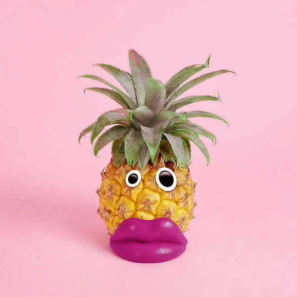 pineapple with face made of fake lips and googly eyes