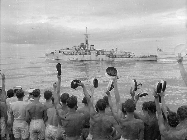 Ship Ahoy. 22nd August 1949: Crew of HMS Jamaica cheering the HMS Amethyst