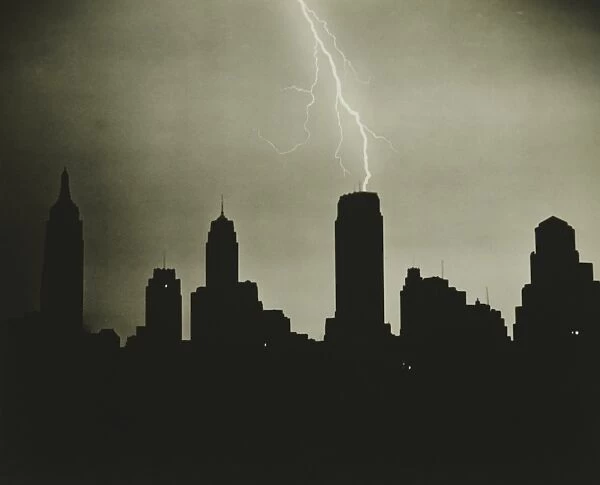 Silhouettes of skyscrapers and lightning on black sky, (B&W)