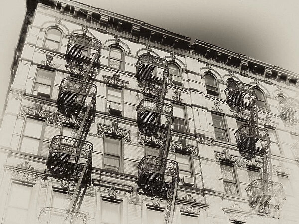 Vintage, sepia-toned rendition of a New York City landmark: fire escapes in tenement building in the Lower East Side