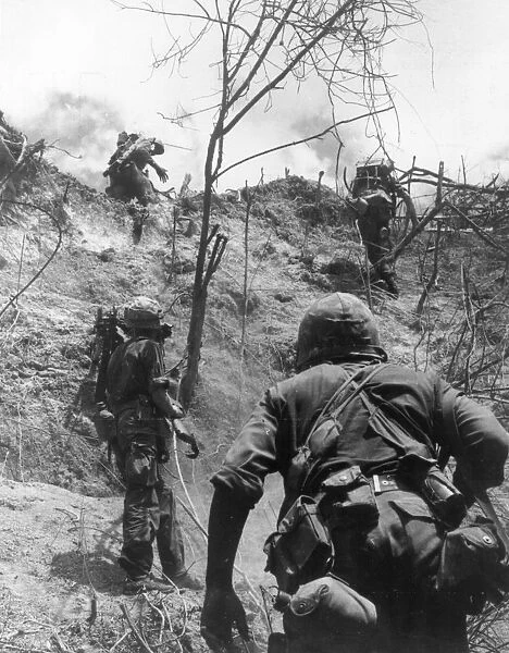 War In Vietnam. Marines of G Company, 4th Marines are pictured climbing