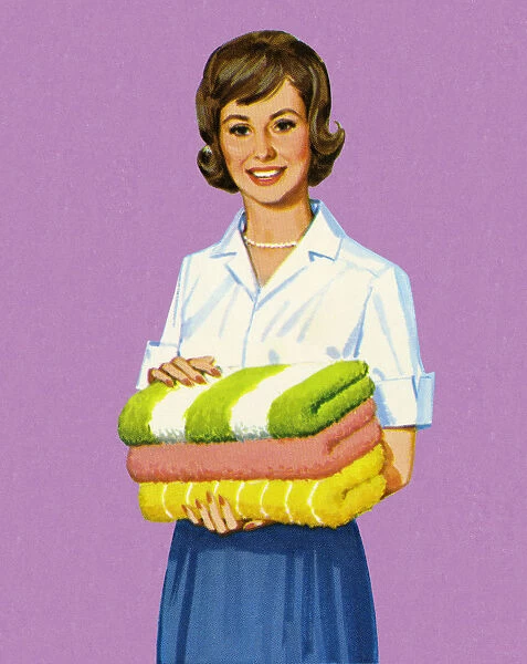 Woman Holding Folded Towels