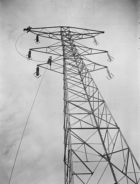 Erecting electricity pylon wires on a grid in Gravesend, Kent. 1939