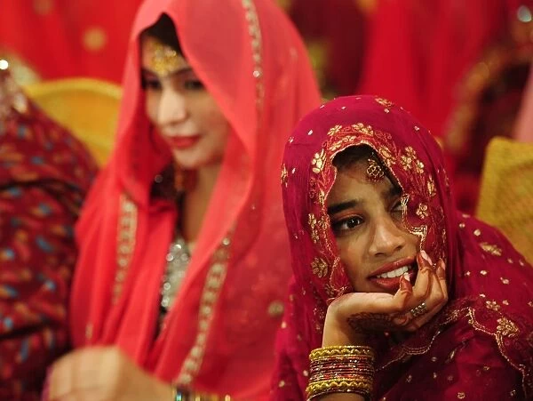 Pakistan-Theme-Love. Pakistani brides attend a mass-wedding ceremony in