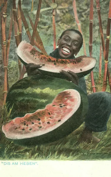 Black man eating a large watermelon (coloured photo)