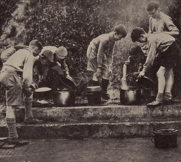 Boys cooking at camp (b  /  w photo)
