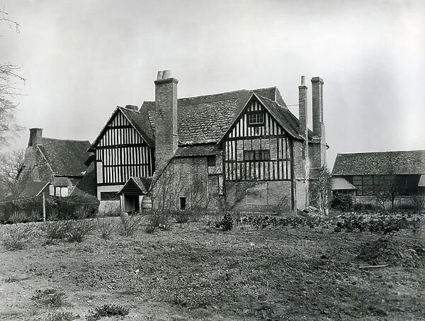 The east front of Crowhurst Place while still a run-down tenant farmhouse, from The English Manor House (b / w photo)