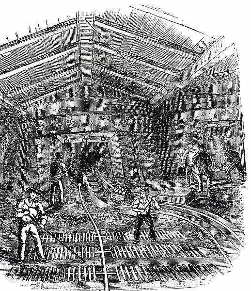 An engraving depicting the casting of iron into ingots or pigs, 19th century