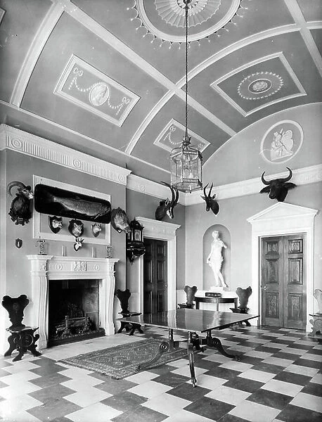 The hall at Shillinglee Hall, Sussex, from England's Lost Houses by Giles Worsley (1961-2006) published 2002 (b / w photo)