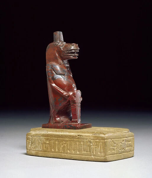Hippopotamus goddess Taueret, holding a plait of rolled papyrus which forms