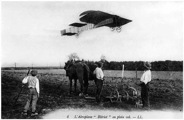 Louis Bleriot (1872-1936) flying in his aeroplane, c. 1909 (b  /  w photo)