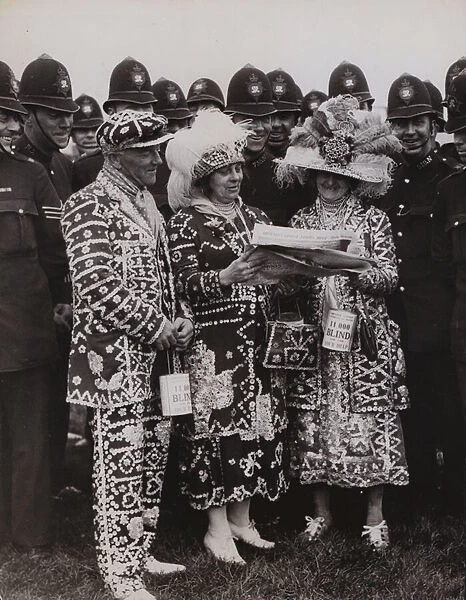 Pearly King and Queens trying to pick the winner on Derby Day at Epsom, 1936 (b  /  w photo)
