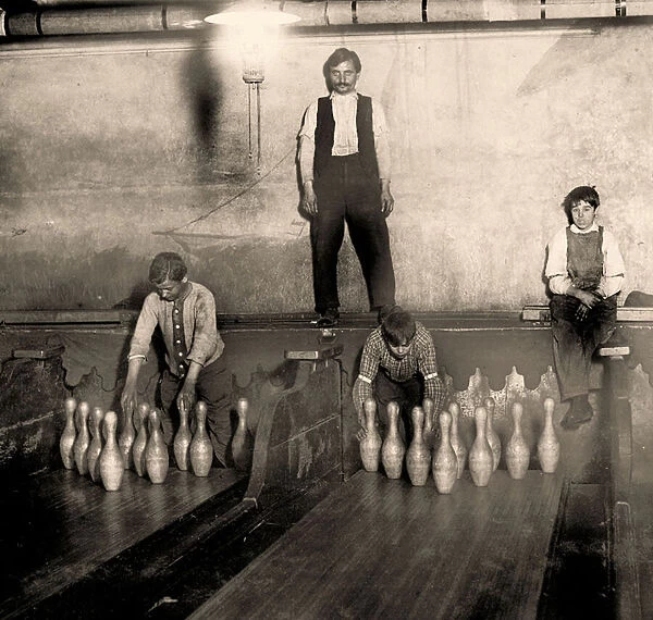 Pinboys in a Subway bowling alley, 65 South Street, Brooklyn. New York. 1910 (photo)