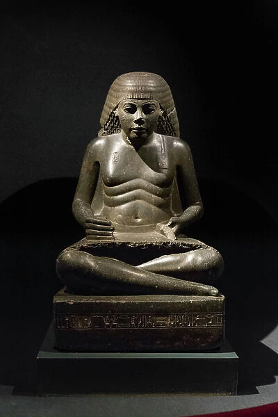 Statue of Amenhotep, son of Hapu, as seated scribe, 18th dynasty, from Karnak (grey granite)