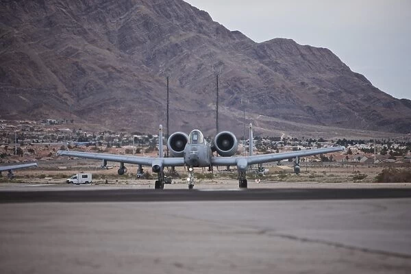 An A-10 Thunderbolt taxis to the runway at Nellis Air Force Base, Nevada