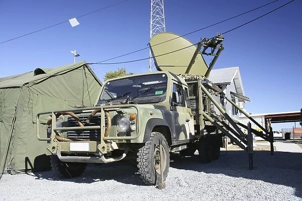 An Australian Defense Force Satellite Terminal Assembly is mounted on a 6x6 vehicle