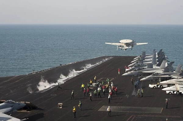 An E-2C Hawkeye launches from the flight deck of USS Harry S. Truman