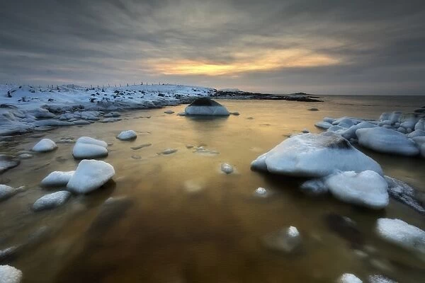A frozen, rusty bay on Andoya Island in Nordland County, Norway