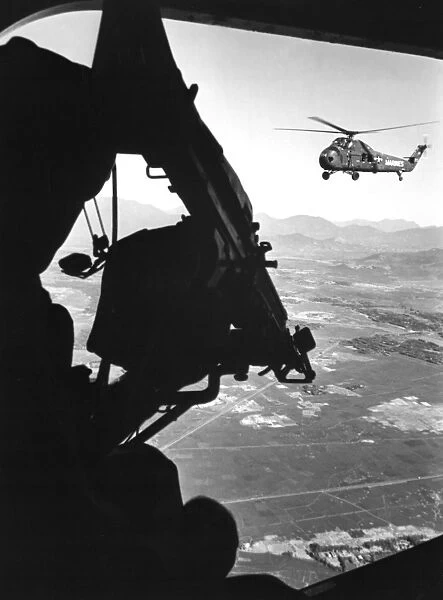 Helicopter and soldier approaching target in Vietnam