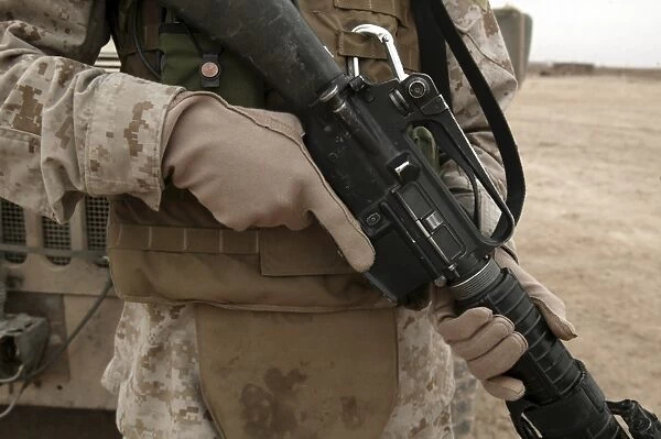 A Marine displays the required hand personal protective equipment