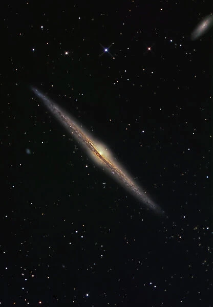 NGC 4565 is an edge-on barred spiral galaxy in the constellation Coma Berenices