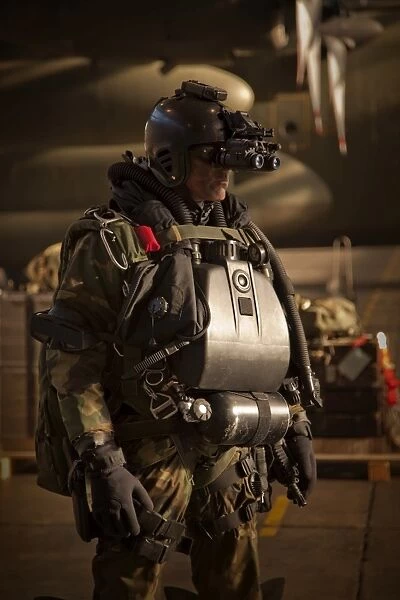 U. S. Navy Seal equipped with night vision prepares for HALO jump operations