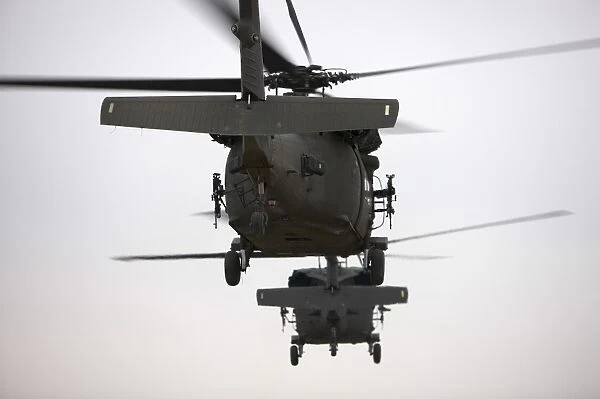 Two UH-60 Black Hawks underway on a mission over northern Iraq