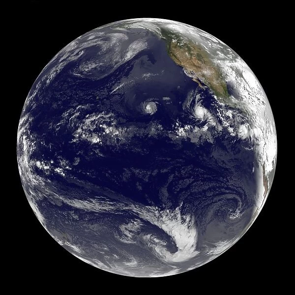 View of Earth showing three tropical cyclones in the Pacific Ocean