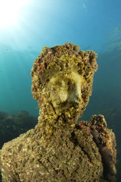Ancient Roman statue of Antonia minor, member of Julio-Claudian dynasty, daughter of Marcus Anthony and sister of emperor Augustus, located in submerged Nymphaeum of Emperor Claudius. Marine Protected Area of Baia, Naples, Italy. Tyrrhenian sea