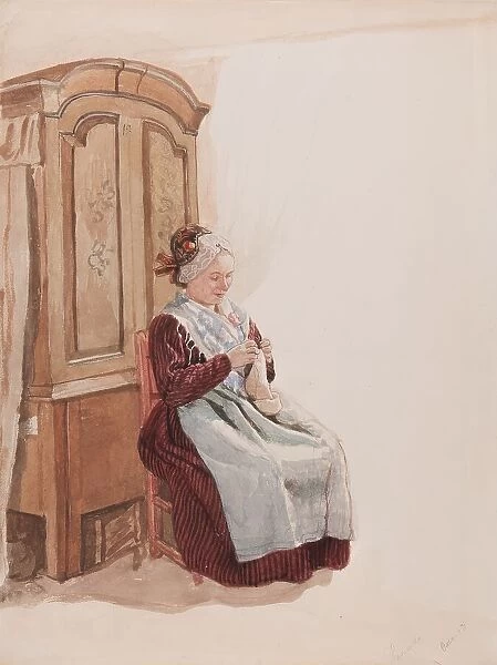 Apparel - Handicraft woman in full figure sitting in front of a cupboard. (c1900s). Creator: AJG Virgin