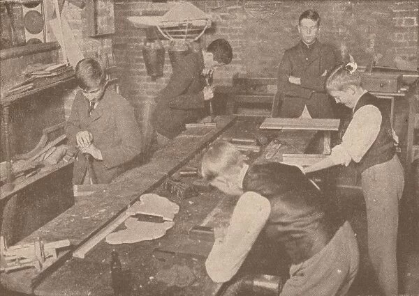 Boys of Harrow School making splints, crutches and other articles for the wounded, c1916 (1928)