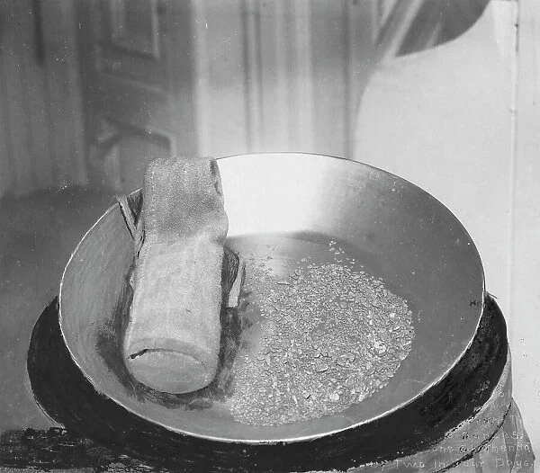 Gold in pan, 1916. Creator: Unknown