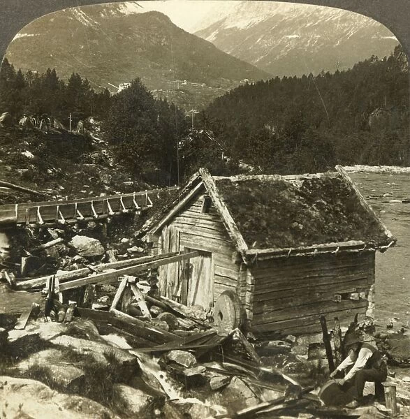 A log-built mill and a water-wheel grindstone, on Stalheims river, Naerodal, Norway, c1905